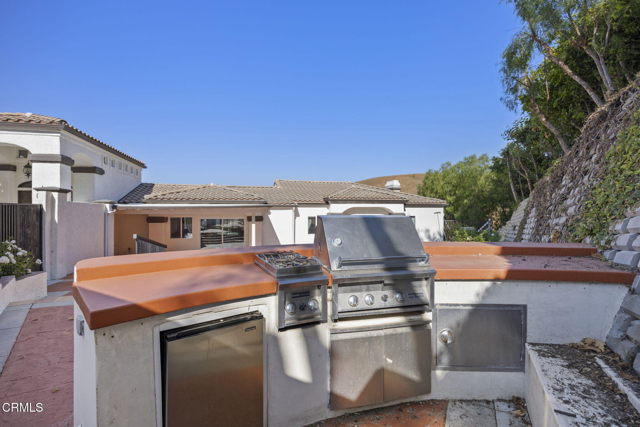 40 Saddlebow Road Bell Canyon, CA 91307 - Photo 70 of 70 a view of a patio with table and chairs with wooden floor and fence