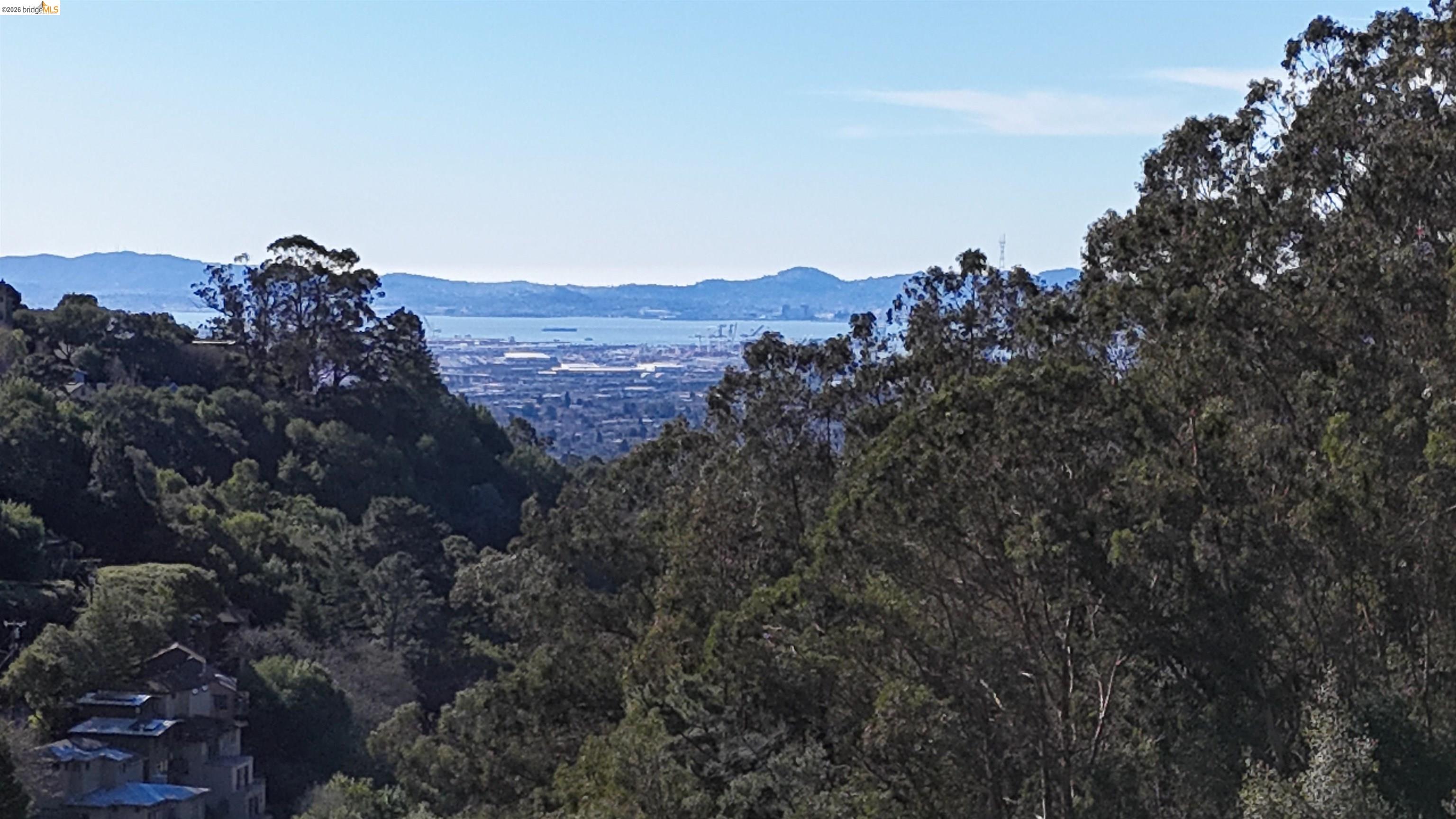 1488 Alvarado Road Berkeley, CA 94705 - Photo 8 of 8 View of mountain backdrop with a heavily wooded area
