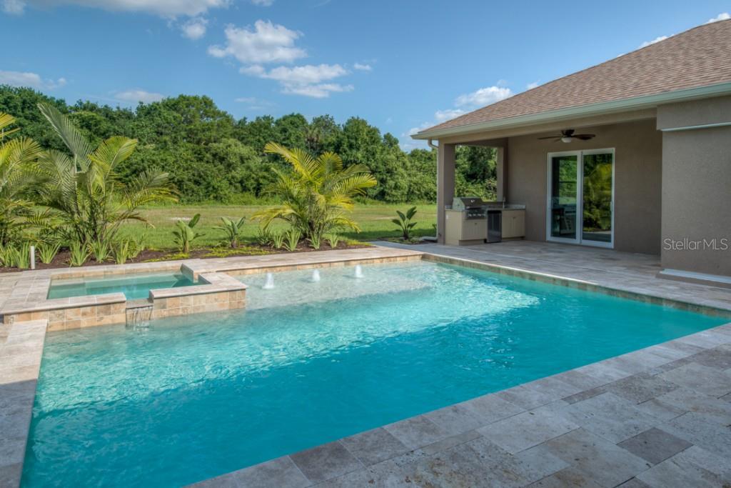 3322 Twin Rivers Trail Parrish, FL 34219 - Photo 4 of 24 Pool with Travertine deck