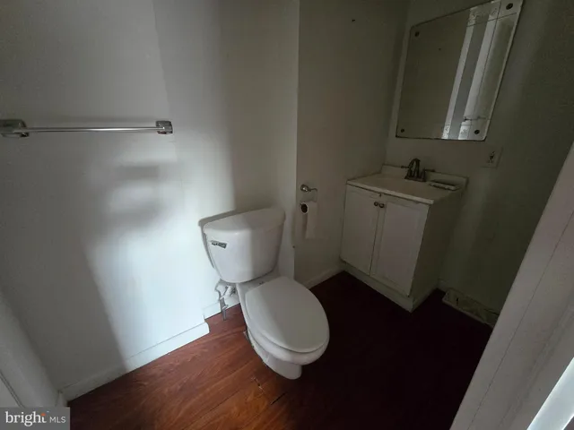 a white toilet sitting next to a bathroom sink