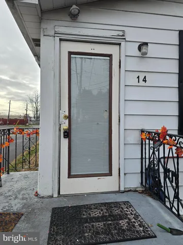a view of a door and a window