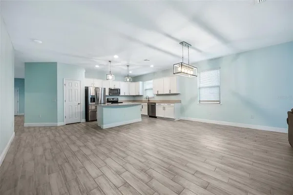 a view of kitchen with wooden floor