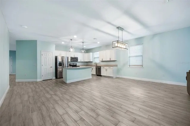 a view of kitchen with wooden floor