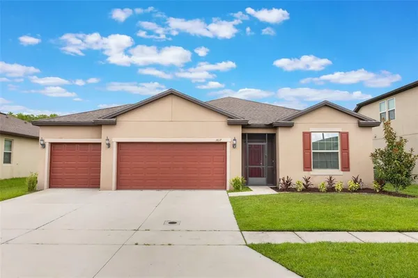 a view of a house with a yard