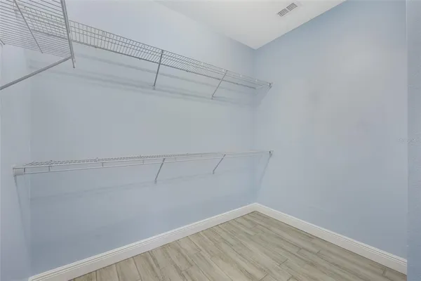 a view of a room with racks on the wall