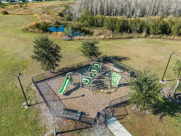 an aerial view of residential houses with outdoor space