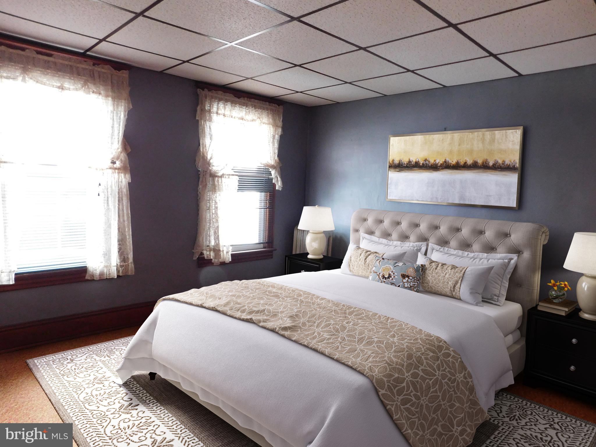 103 East Amidon Street Summit Hill, PA 18250 - Photo 11 of 16 a spacious bedroom with a bed and window