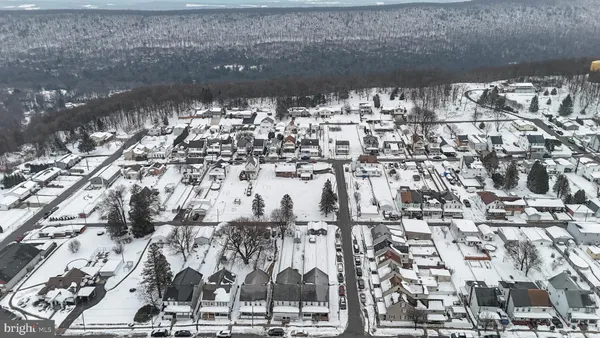a view of lot of residential space with parking space