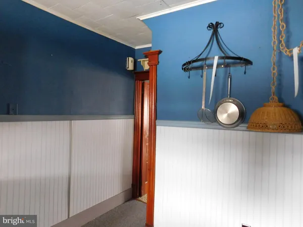 a bathroom with a sink toilet and a mirror