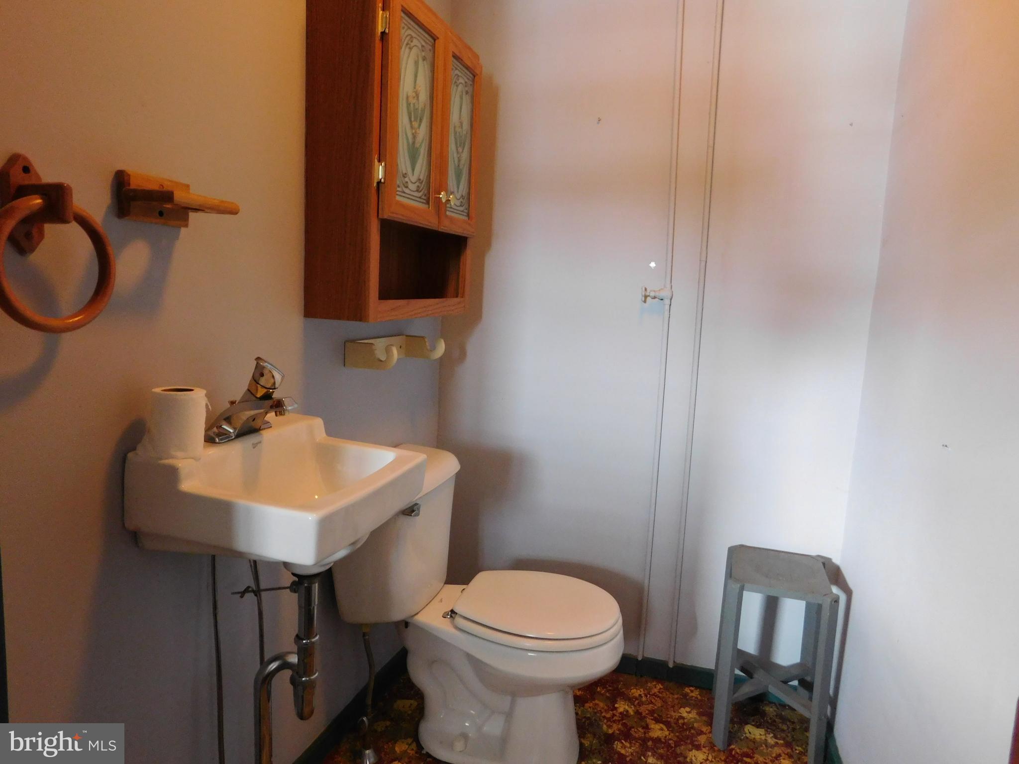 103 East Amidon Street Summit Hill, PA 18250 - Photo 8 of 16 a bathroom with a sink toilet and a mirror