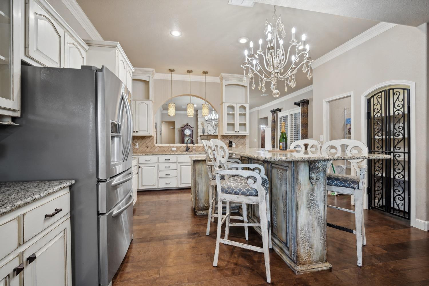 3902 101st Street Lubbock, TX 79423 - Photo 14 of 37 a kitchen with cabinets and stainless steel appliances