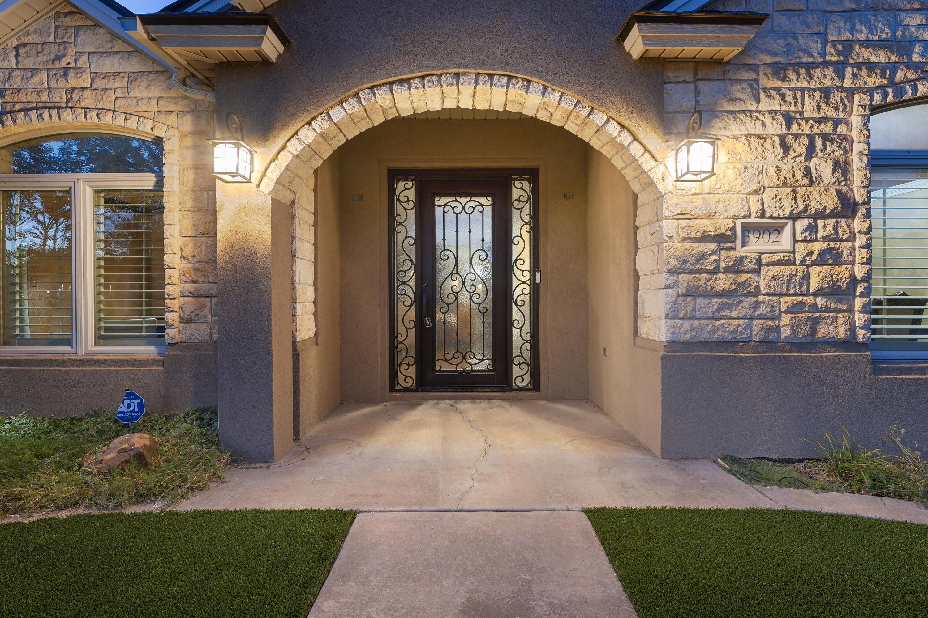 3902 101st Street Lubbock, TX 79423 - Photo 3 of 37 a view of entryway with a flower garden