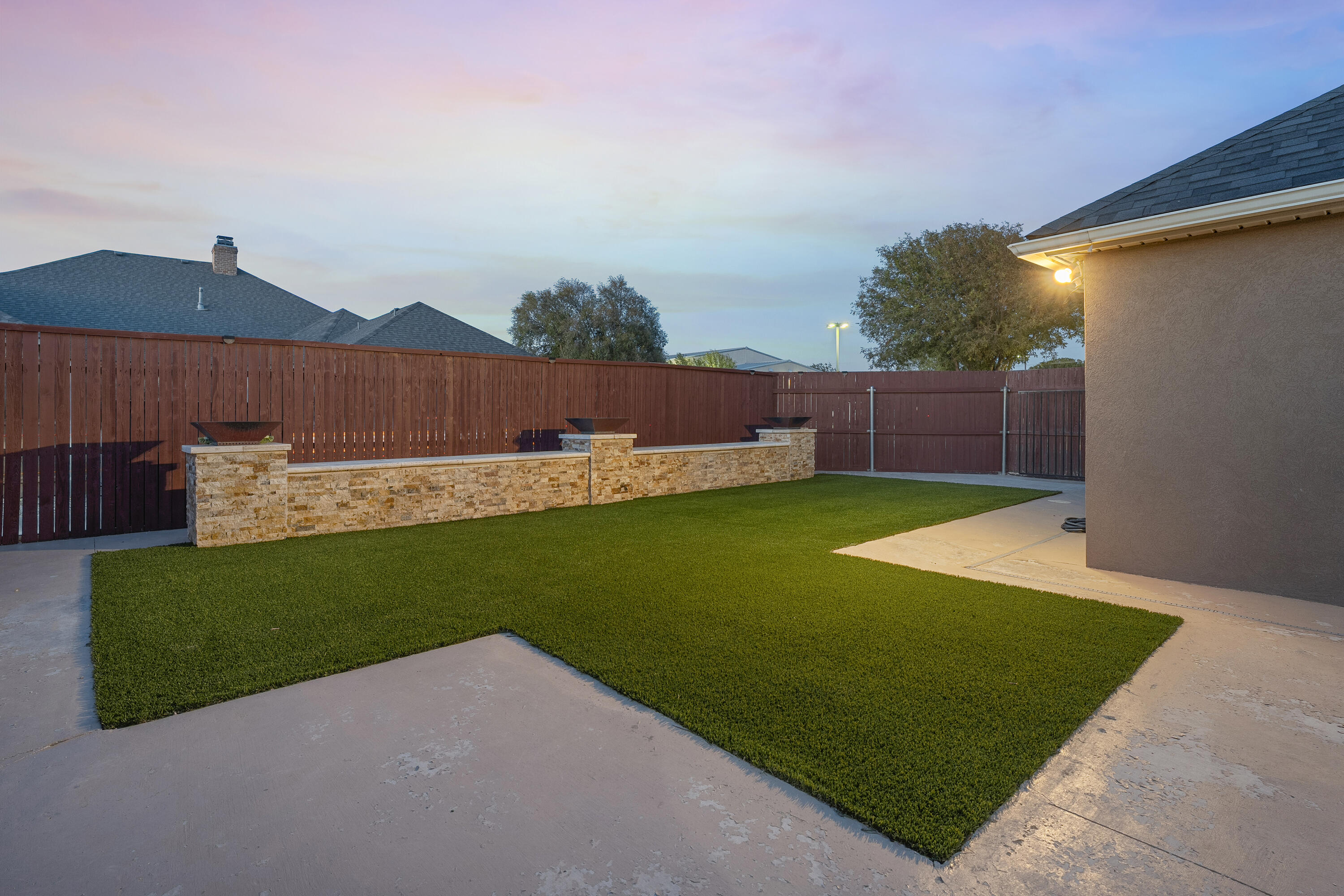 3902 101st Street Lubbock, TX 79423 - Photo 4 of 37 a view of a backyard with a garden