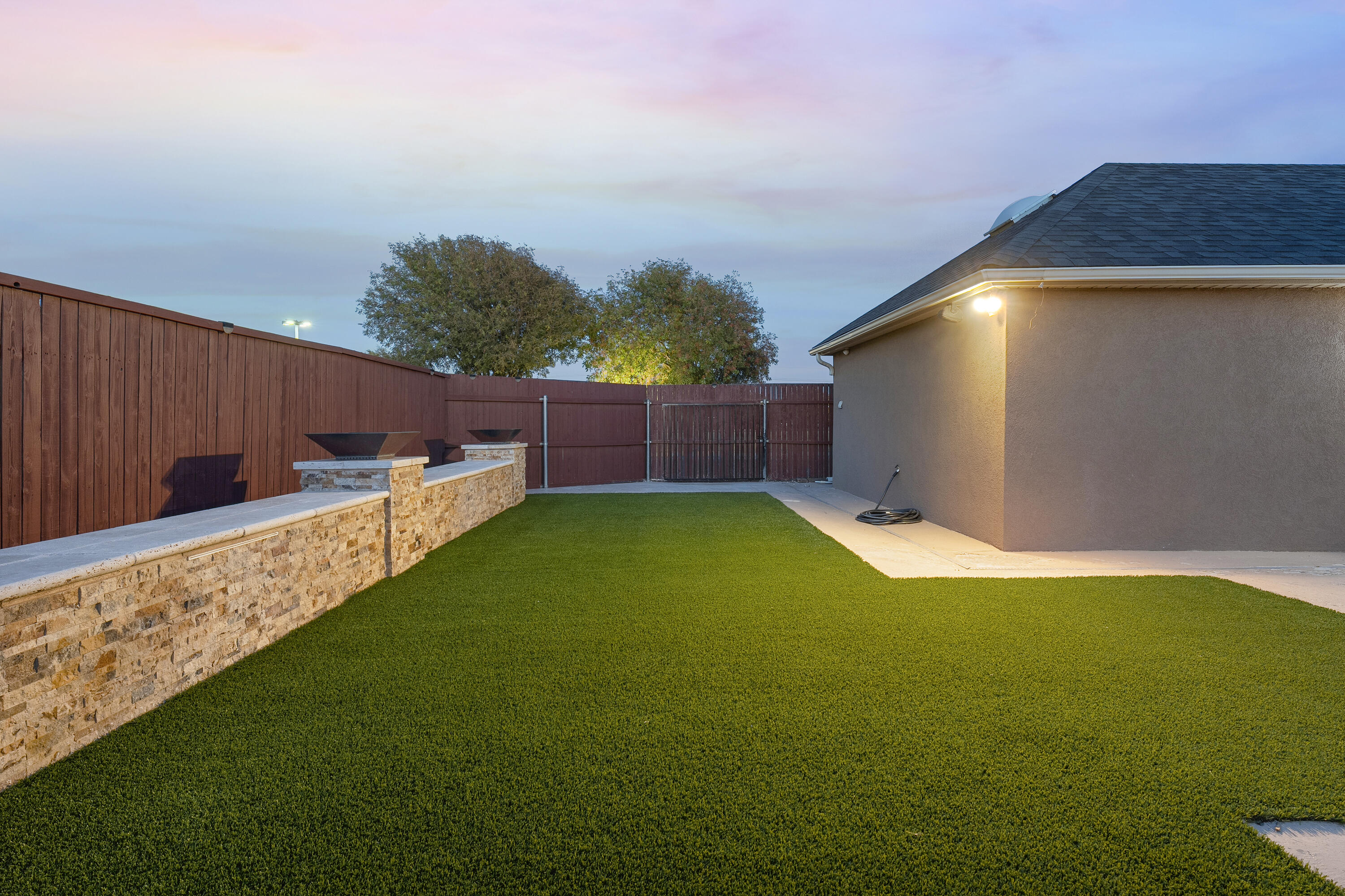 3902 101st Street Lubbock, TX 79423 - Photo 5 of 37 a backyard of a house with table and chairs