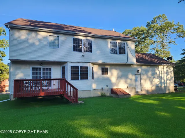 a view of an empty room and a window