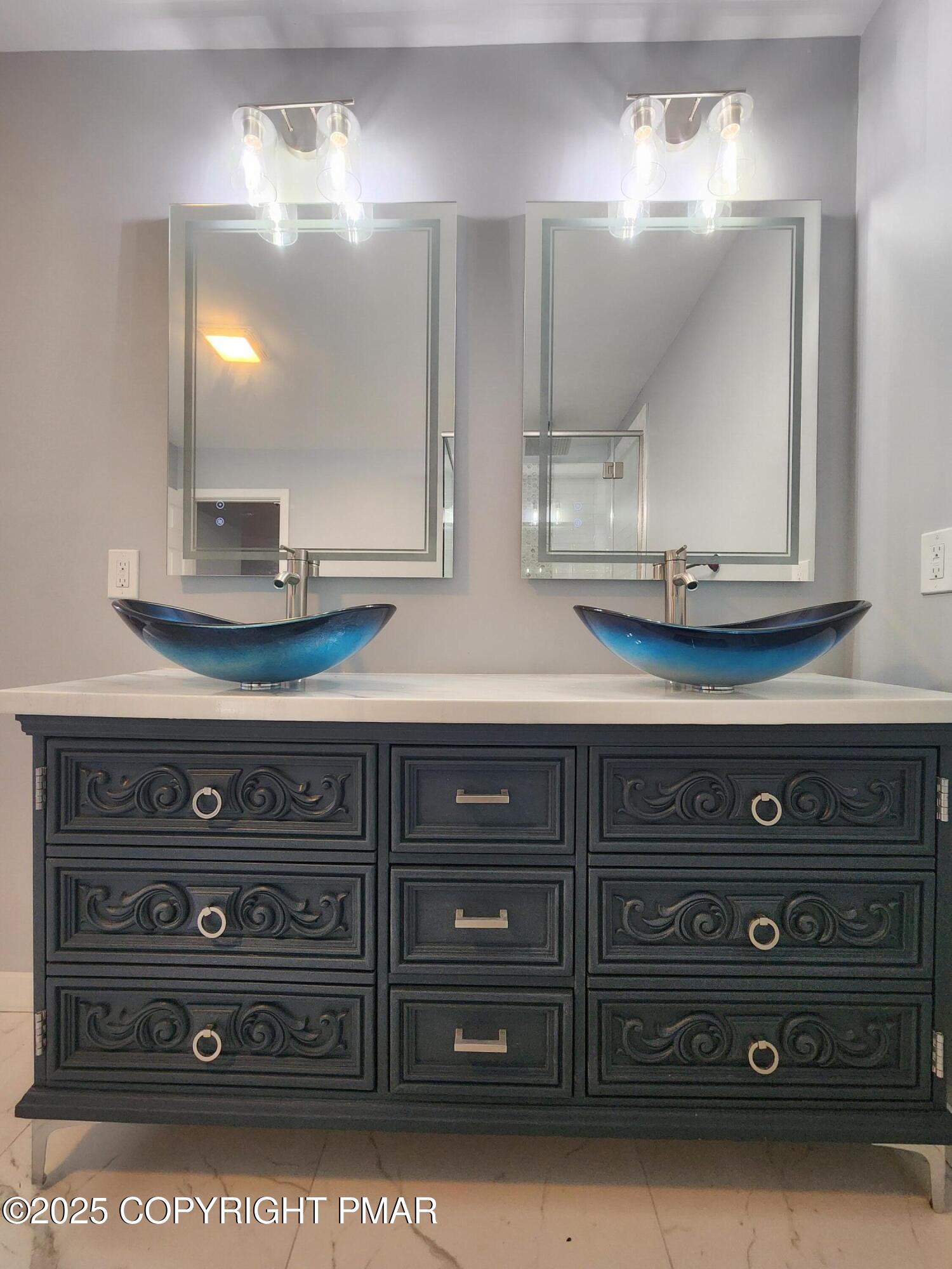 283 Pocono Boulevard Bushkill, PA 18324 - Photo 34 of 44 a bathroom with a sink and a mirror