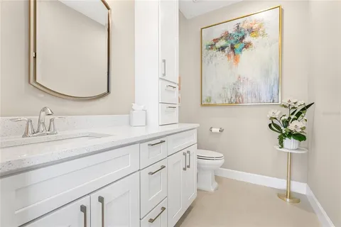 a view of a house with backyard outdoor seating and hardwood