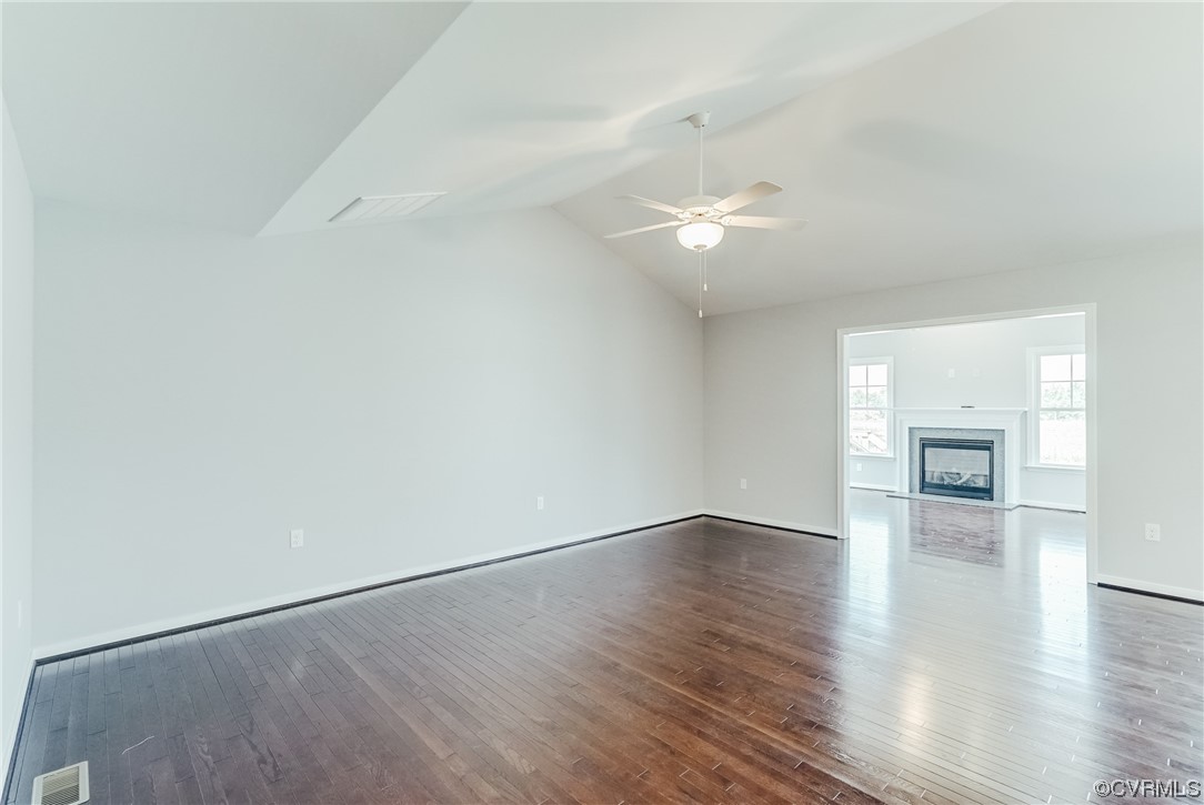Tbd Rockahock Road Lanexa, VA 23089 - Photo 13 of 26 an empty room with wooden floor fireplace and windows