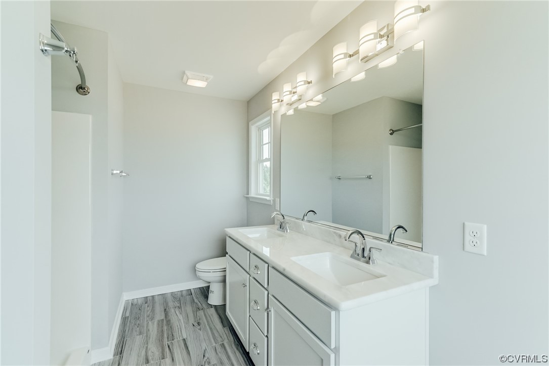 Tbd Rockahock Road Lanexa, VA 23089 - Photo 15 of 26 a bathroom with a sink toilet and a mirror