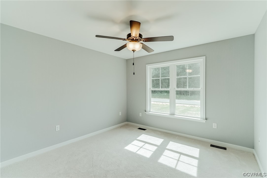 Tbd Rockahock Road Lanexa, VA 23089 - Photo 19 of 26 an empty room with windows and fan
