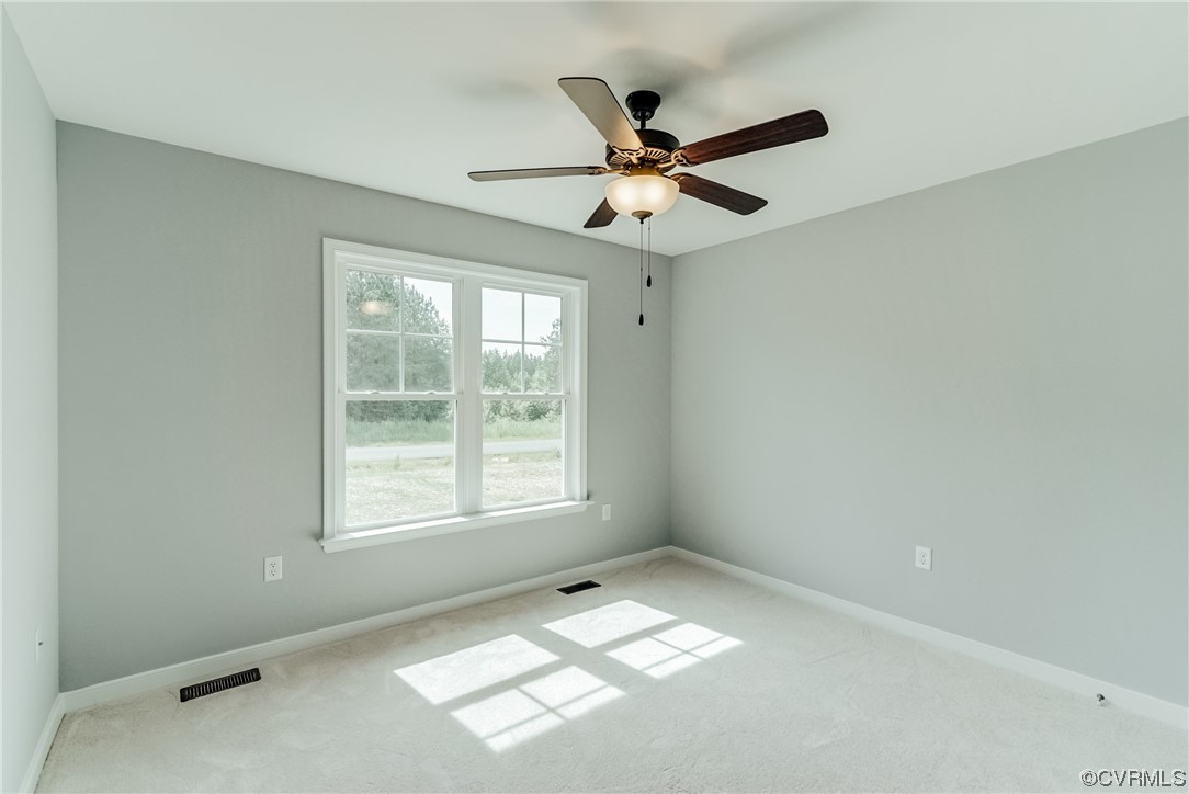 Tbd Rockahock Road Lanexa, VA 23089 - Photo 20 of 26 an empty room with windows and fan