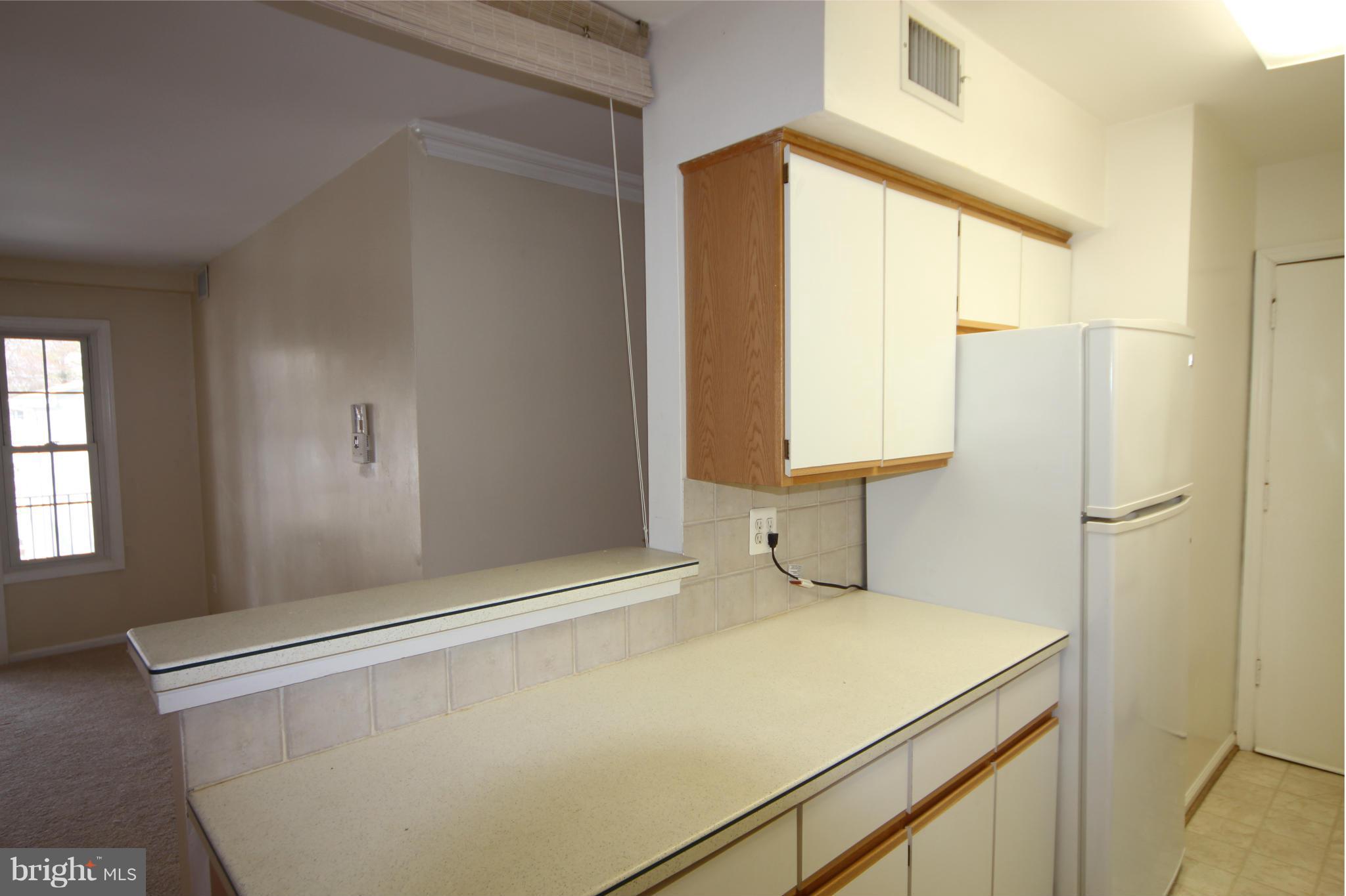 5904 D Kingsford Road, Unit 417 Springfield, VA 22152 - Photo 6 of 23 Kitchen view into Living Room