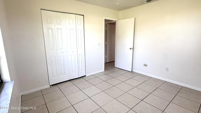 a view of a utility room with wooden floor