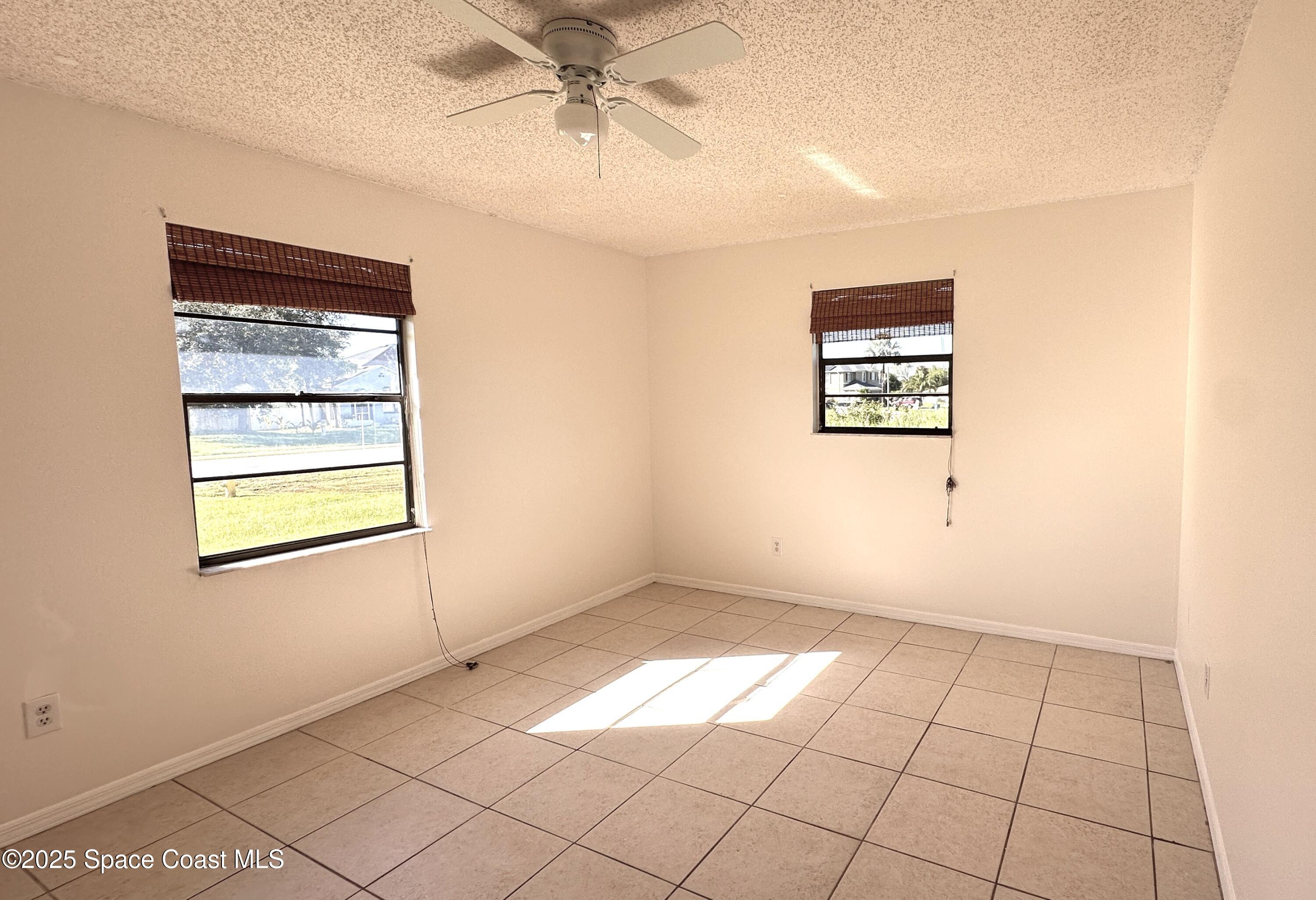 3807 Jupiter Boulevard Southeast Palm Bay, FL 32909 - Photo 18 of 34 a view of an empty room with a window