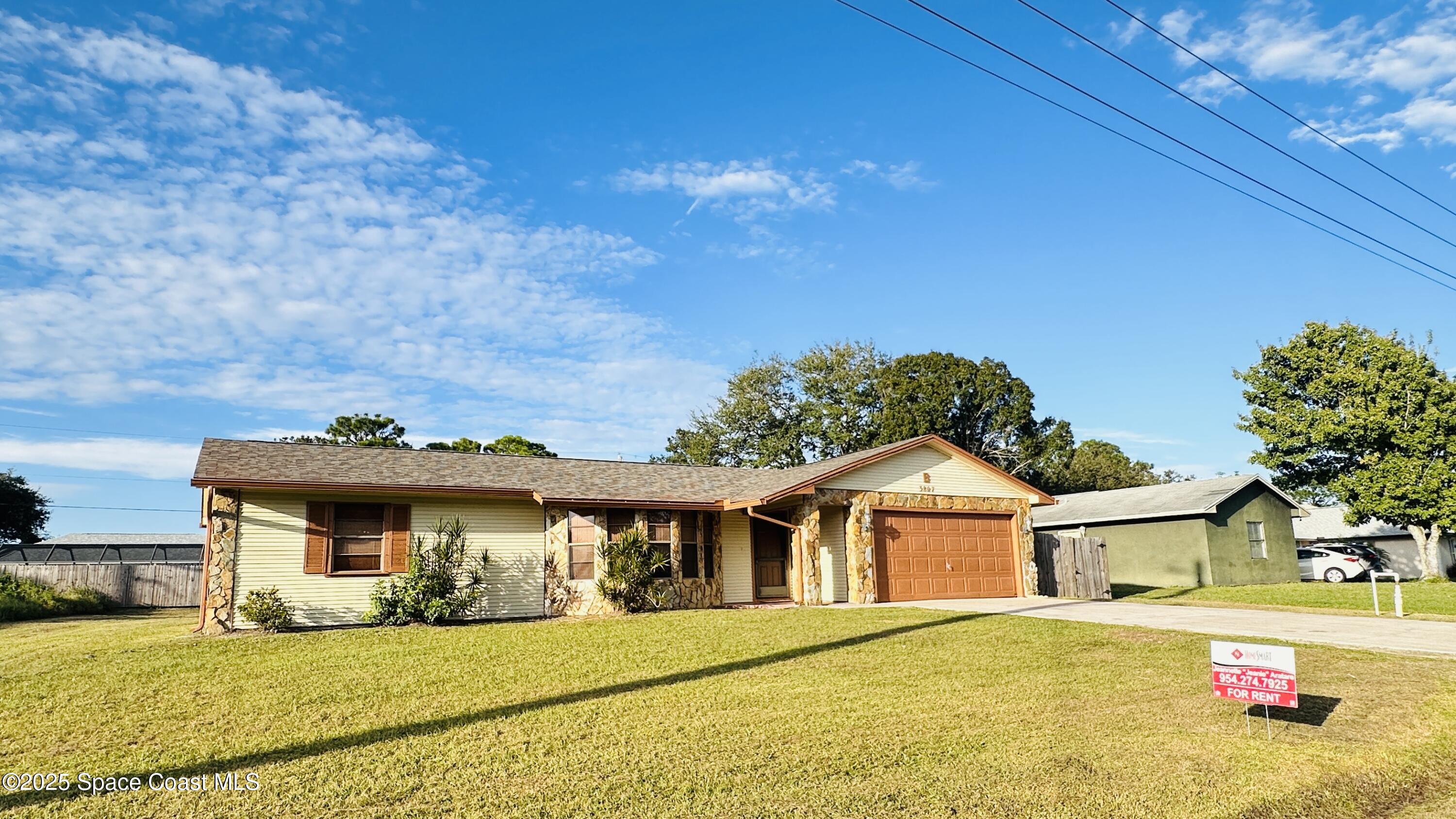 3807 Jupiter Boulevard Southeast Palm Bay, FL 32909 - Photo 2 of 34 a view of a house with a outdoor space