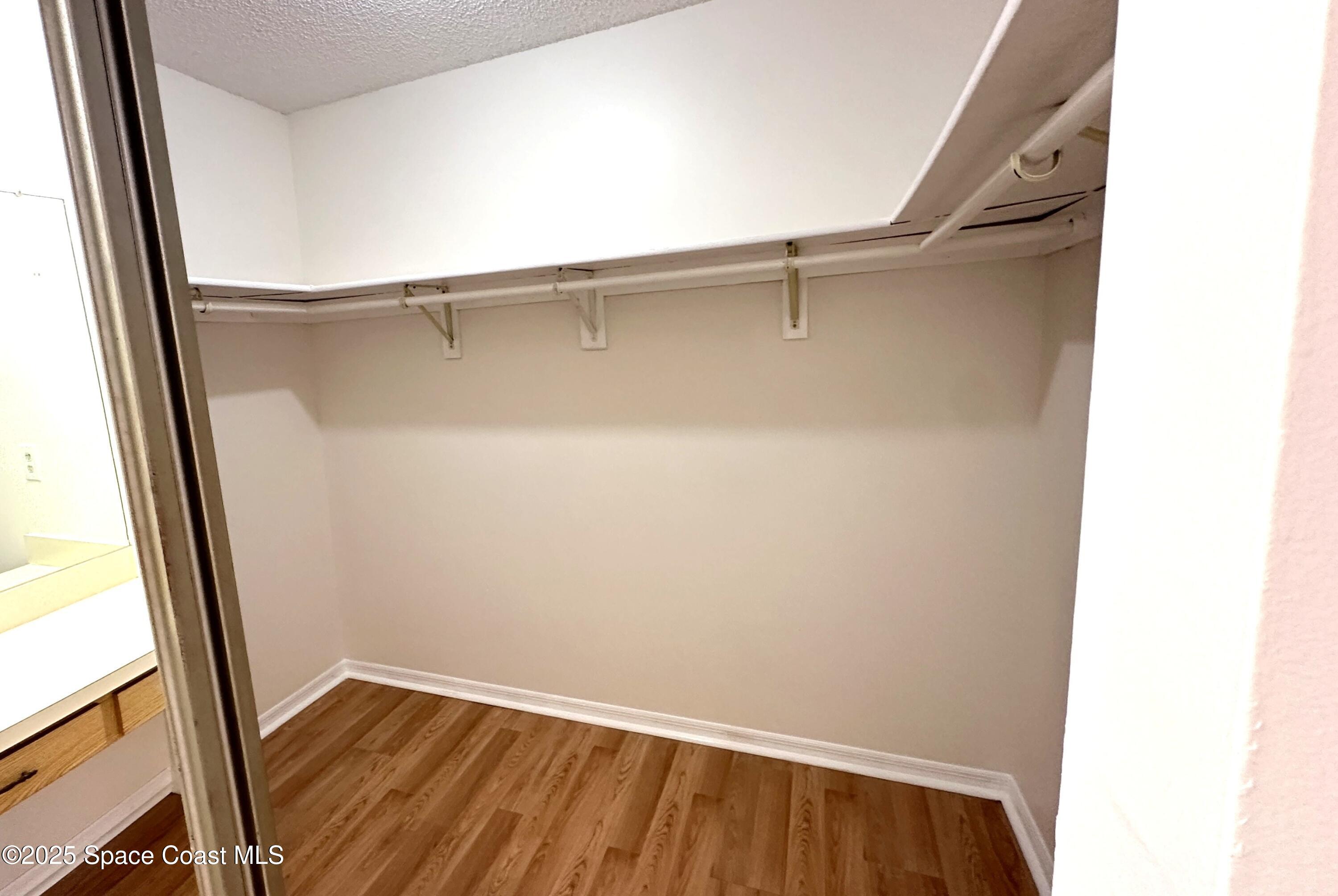 3807 Jupiter Boulevard Southeast Palm Bay, FL 32909 - Photo 25 of 34 a view of walk in closet with empty racks