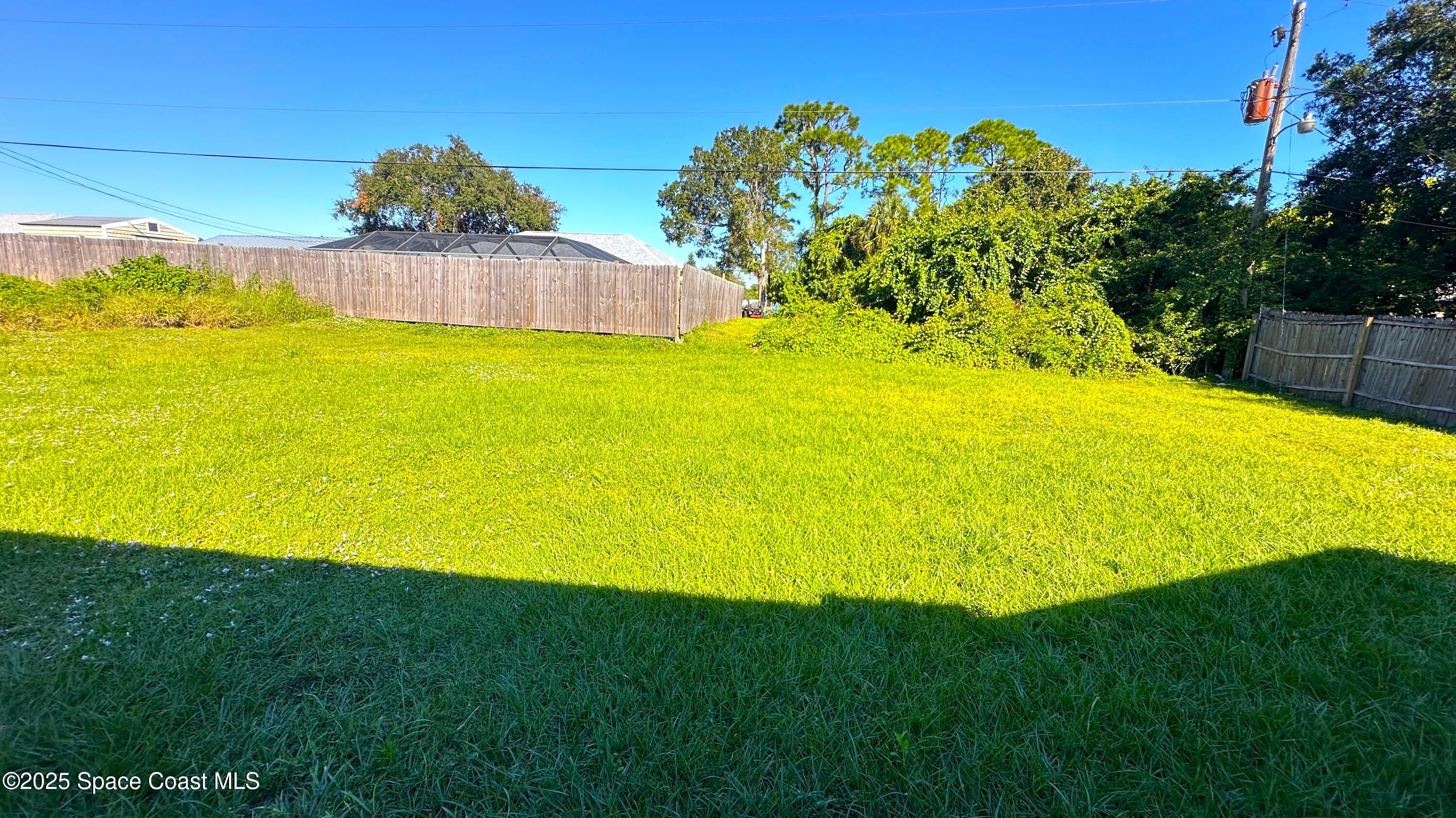 3807 Jupiter Boulevard Southeast Palm Bay, FL 32909 - Photo 33 of 34 a view of a swimming pool with an outdoor space