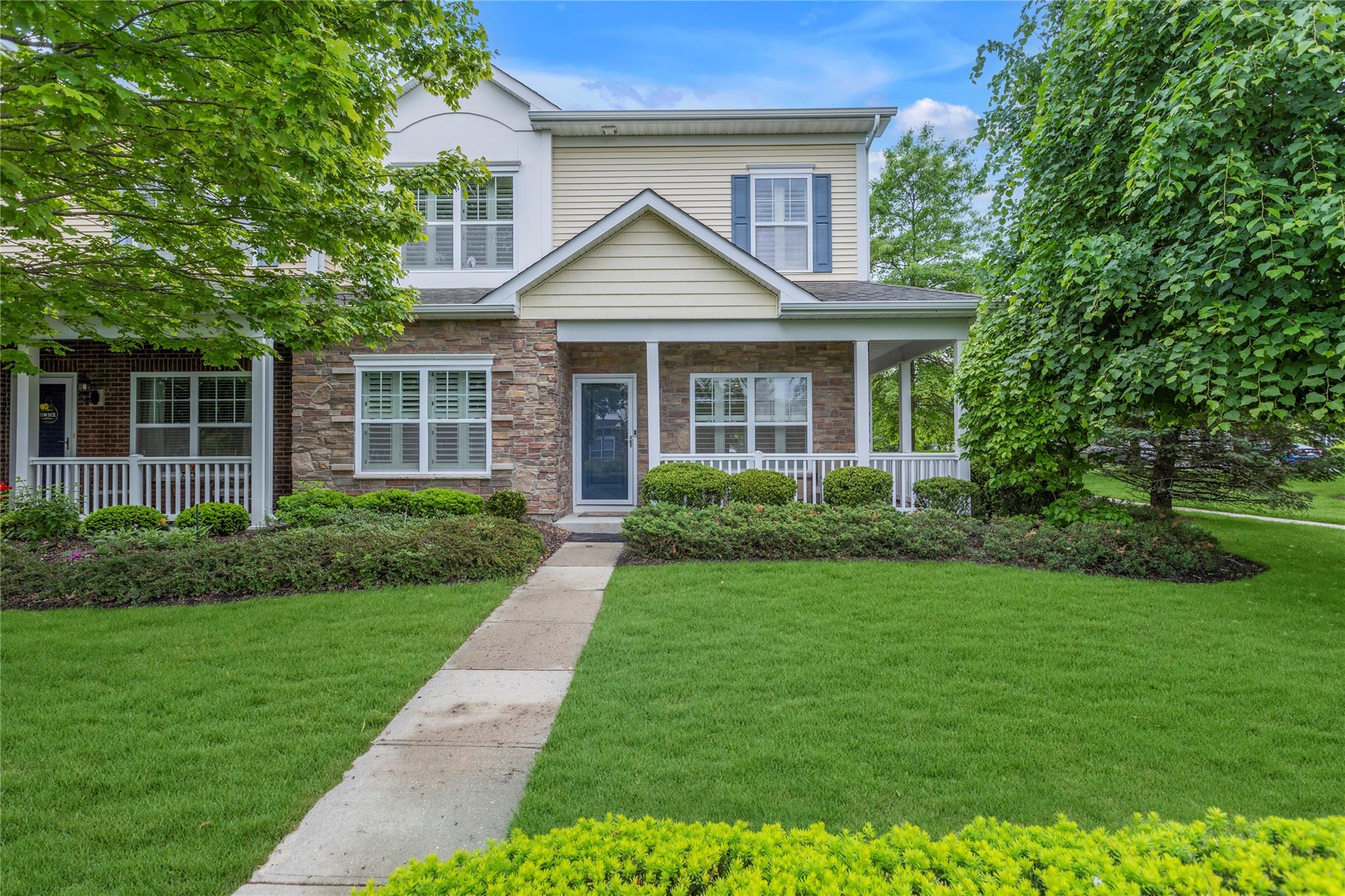 27 Lager Lane Patchogue, NY 11772 - Photo 1 of 1 View of front of home with a porch, stone siding, and a front yard