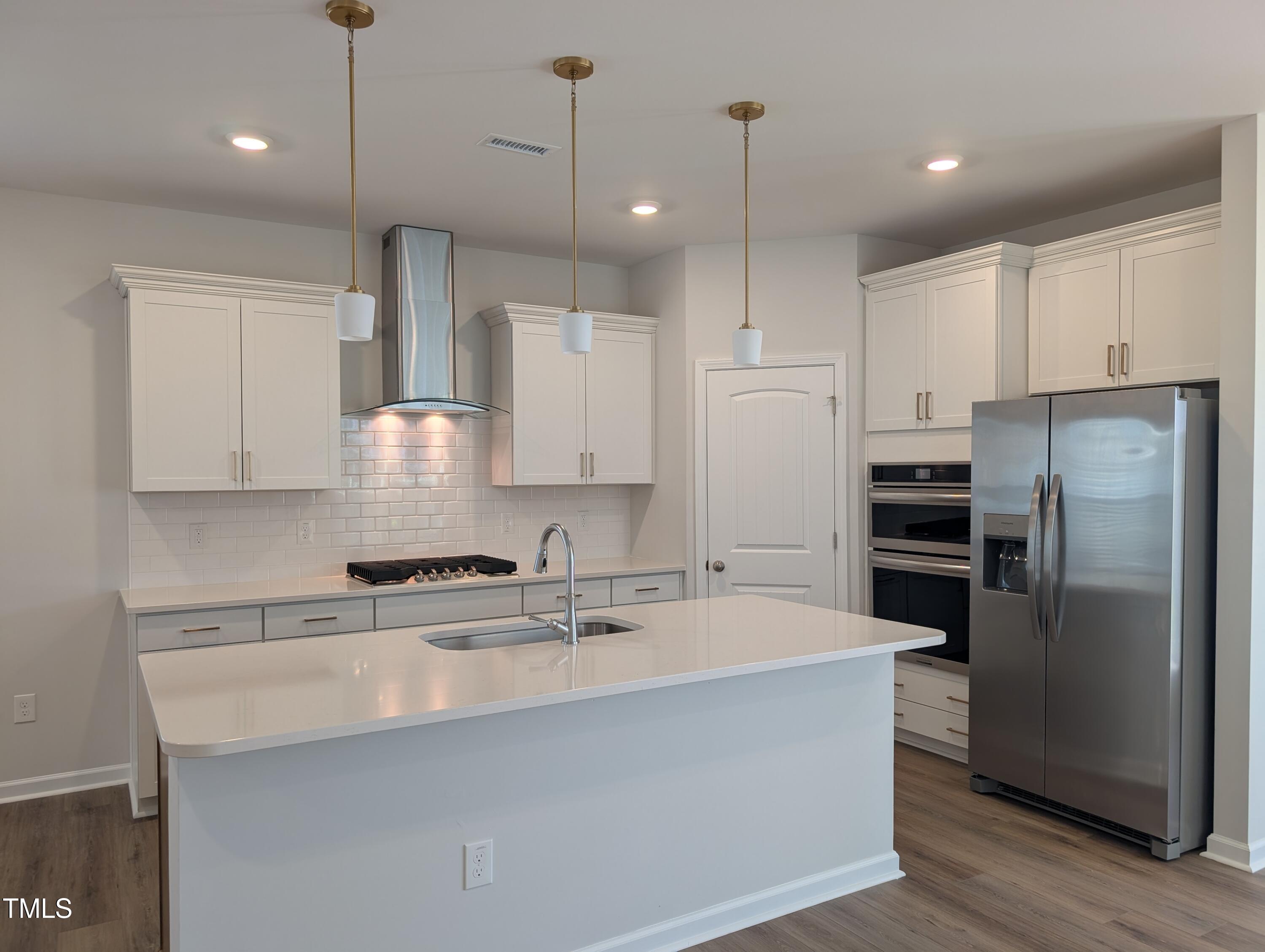 9224 Leaning Post Road, Unit 445 Wake Forest, NC 27587 - Photo 10 of 28 Kitchen Island