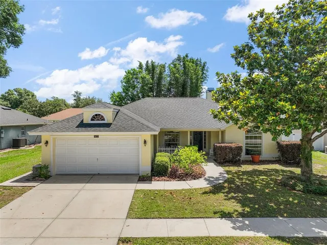 front view of a house with a yard