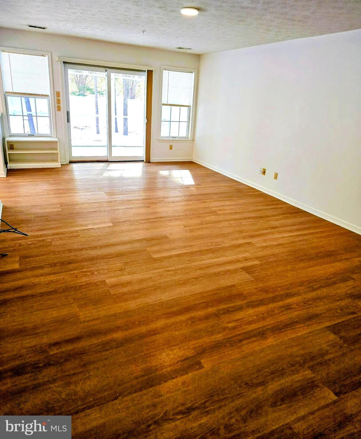 44045 Fieldstone Way California, MD 20619 - Photo 7 of 37 Large living room leading to porch and patio