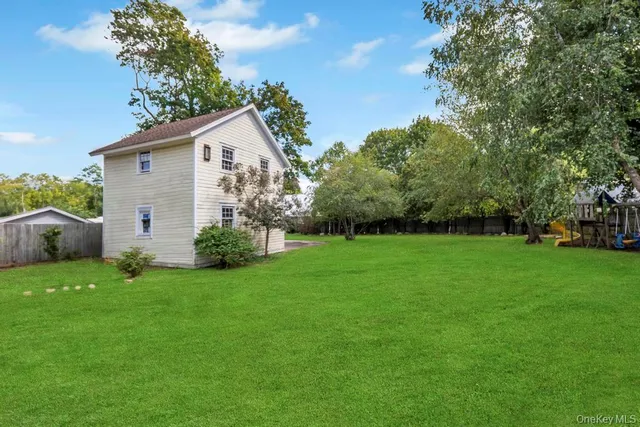 a view of a backyard with a house and garden