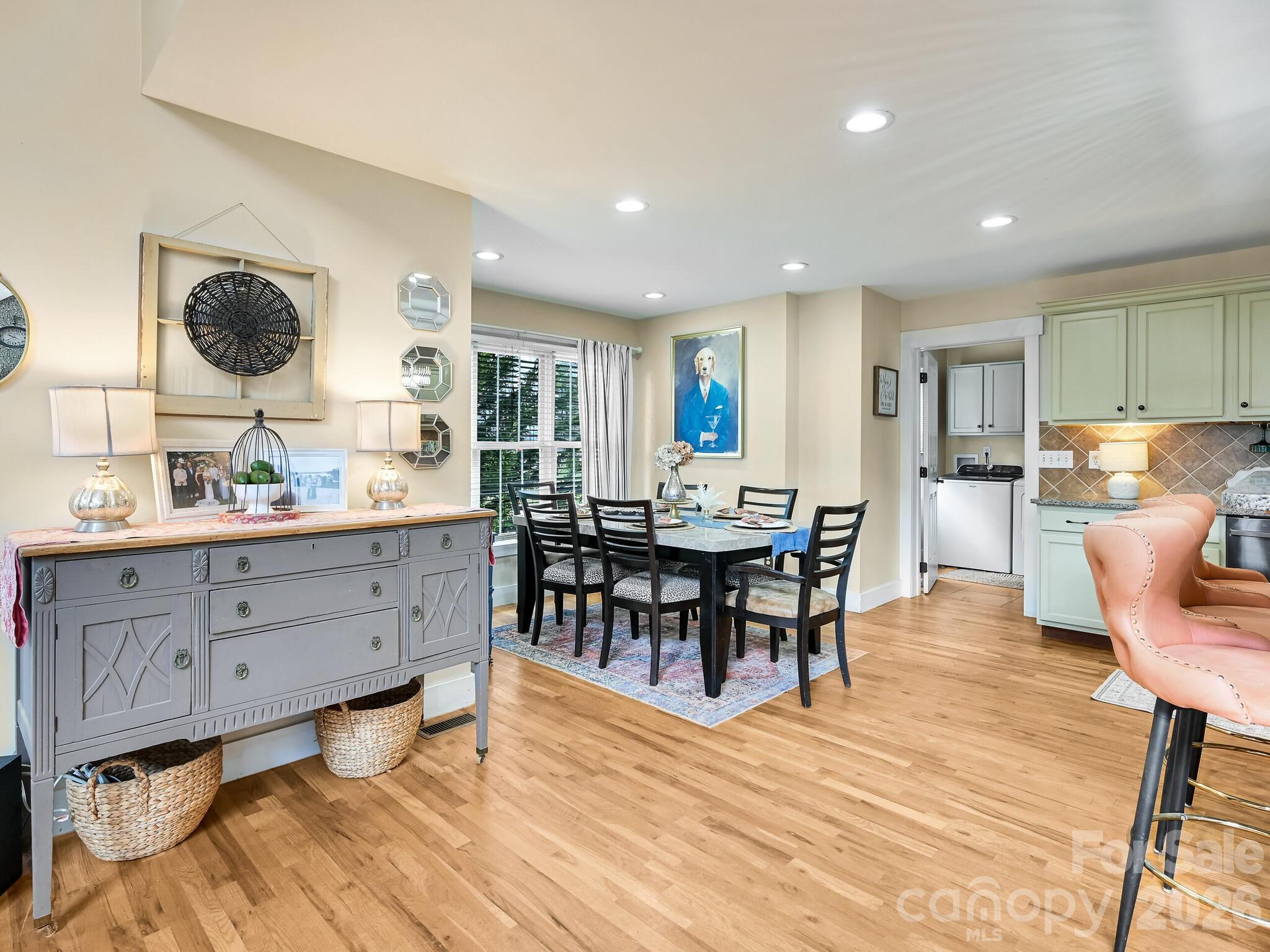 1645 Ivy Hill Road Marshall, NC 28753 - Photo 17 of 36 a view of a dining room with furniture and wooden floor