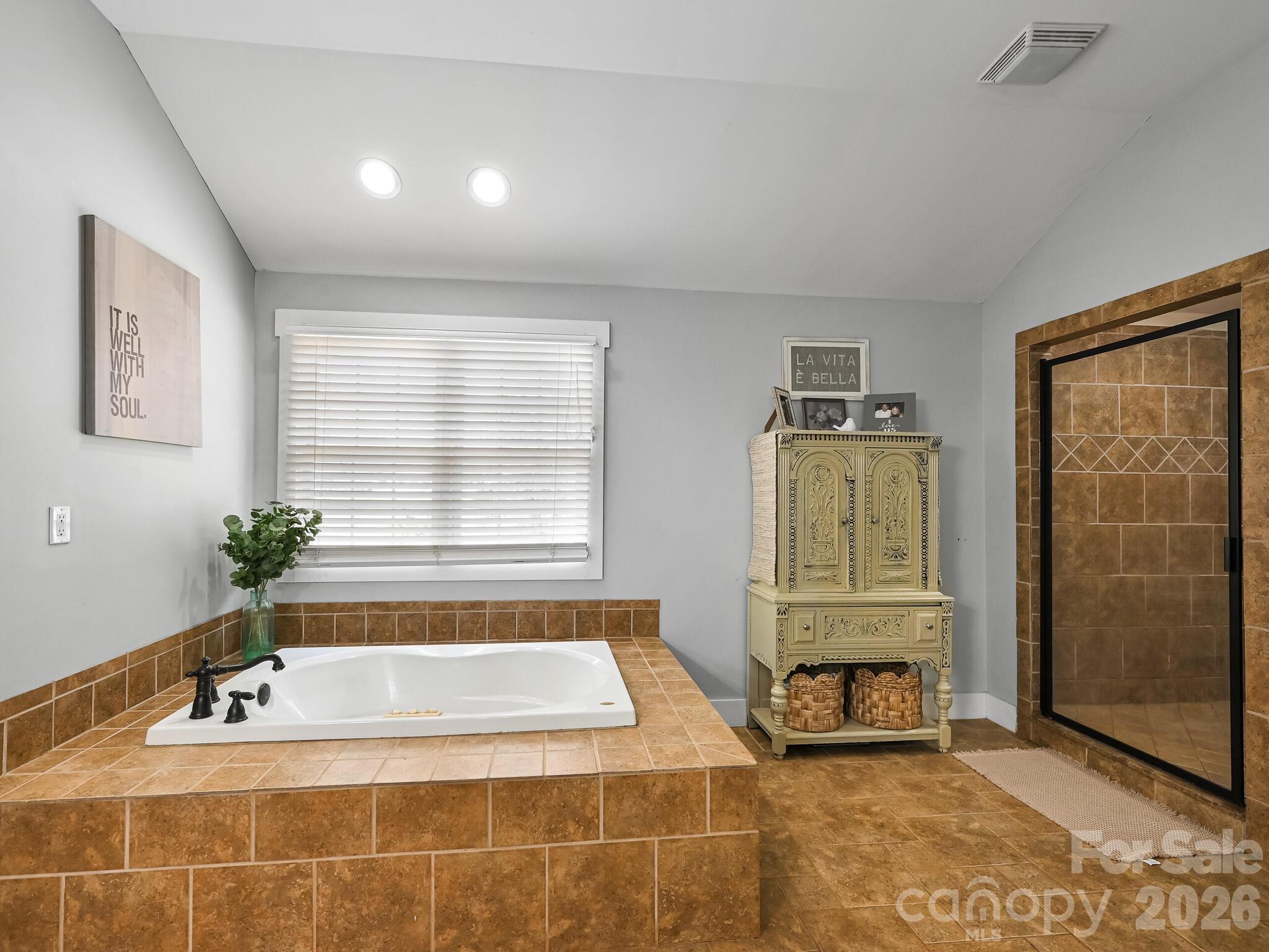 1645 Ivy Hill Road Marshall, NC 28753 - Photo 21 of 36 a bathroom with a bathtub and a shower