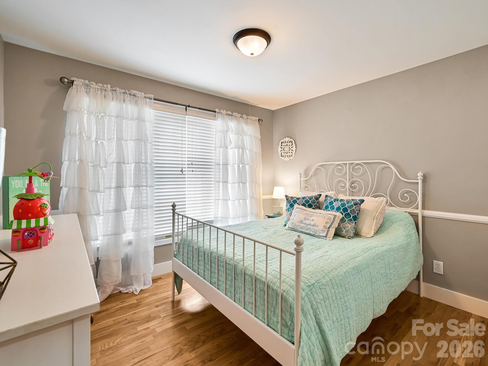1645 Ivy Hill Road Marshall, NC 28753 - Photo 25 of 36 a bedroom with a bed and a window