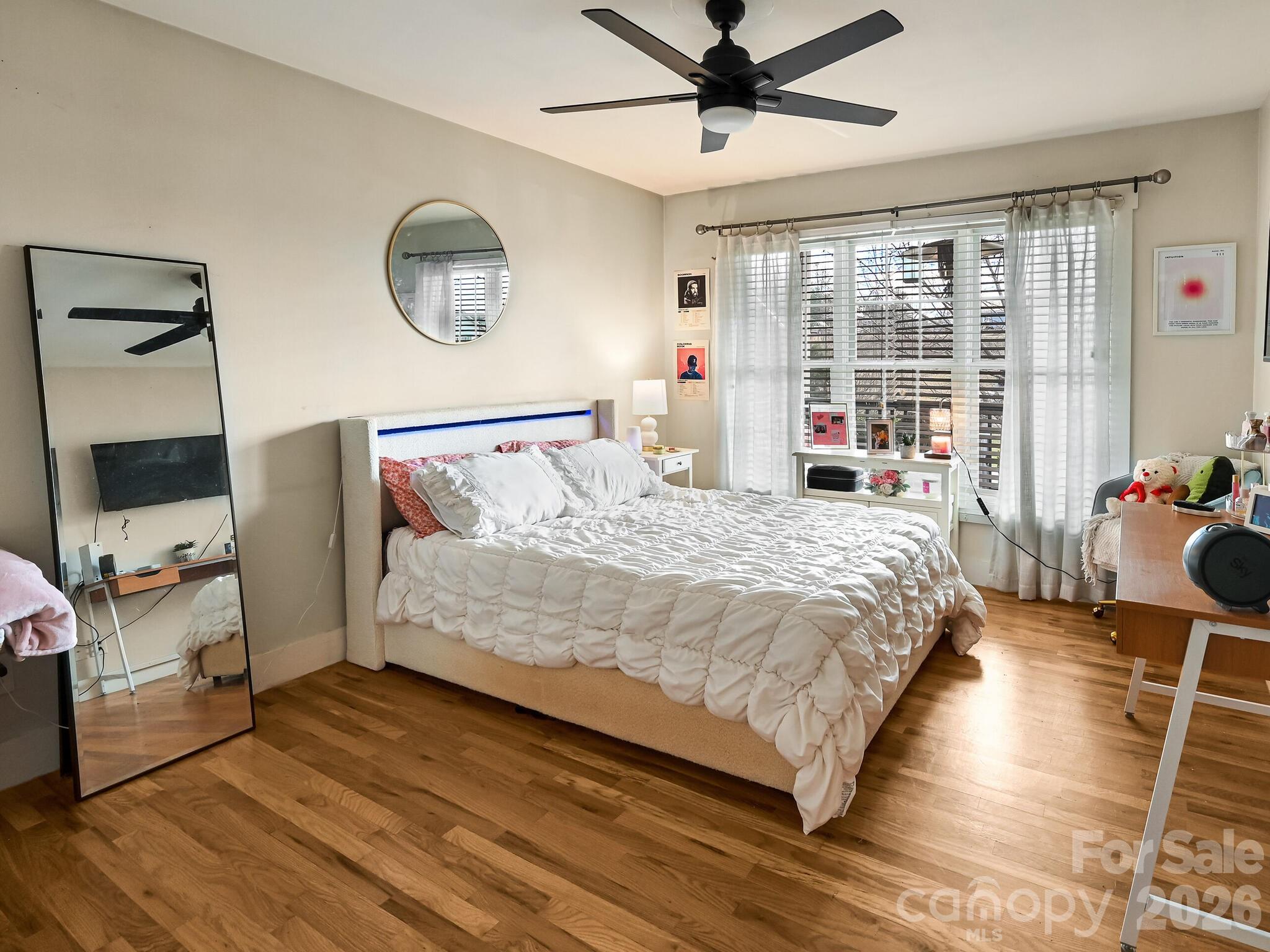 1645 Ivy Hill Road Marshall, NC 28753 - Photo 26 of 36 a bedroom with a bed mirror and window