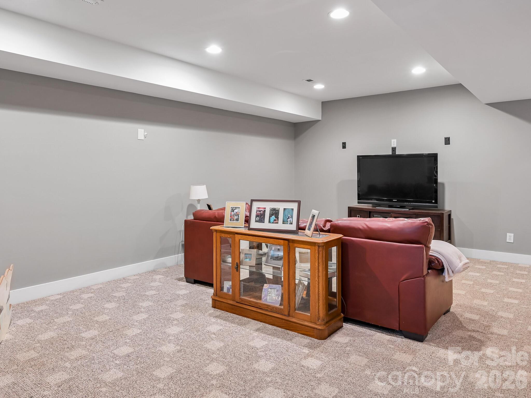 1645 Ivy Hill Road Marshall, NC 28753 - Photo 31 of 36 a living room with furniture and a flat screen tv