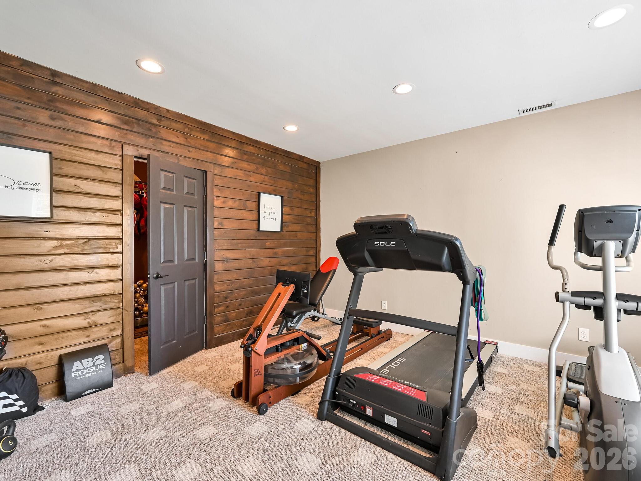 1645 Ivy Hill Road Marshall, NC 28753 - Photo 32 of 36 a room with gym equipment and air hockey table