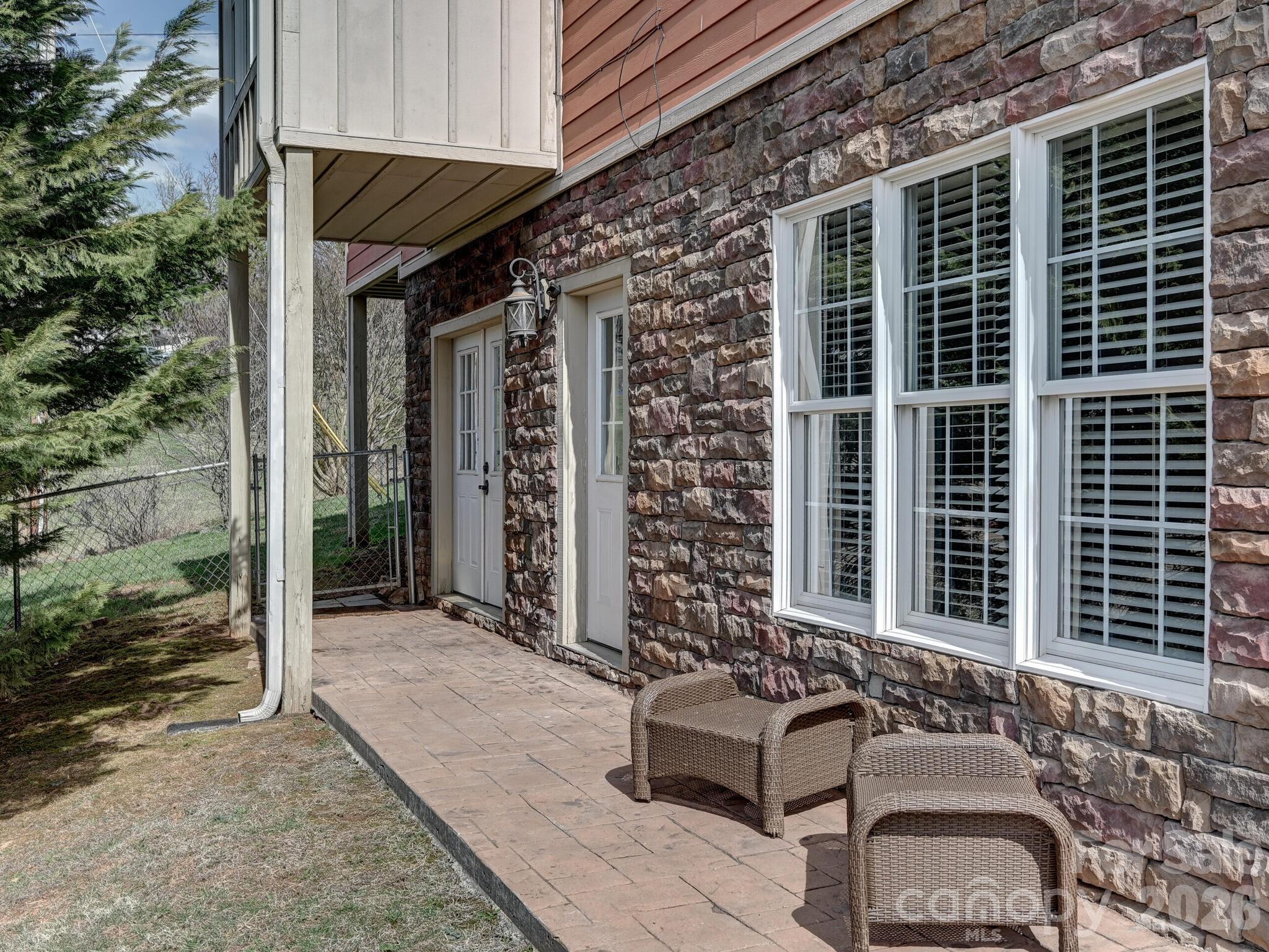 1645 Ivy Hill Road Marshall, NC 28753 - Photo 33 of 36 a front view of a house with outdoor seating