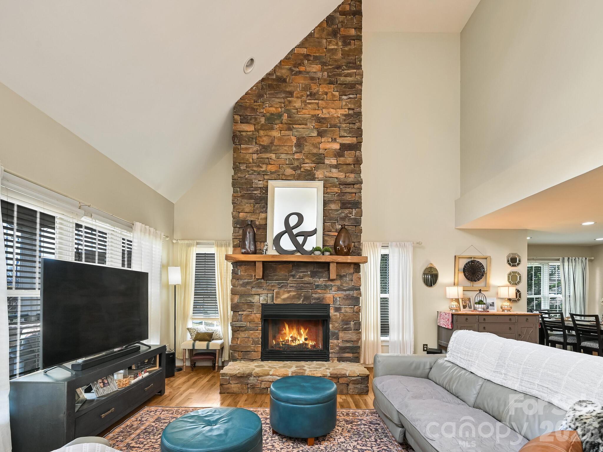 1645 Ivy Hill Road Marshall, NC 28753 - Photo 7 of 36 a living room with furniture and a flat screen tv