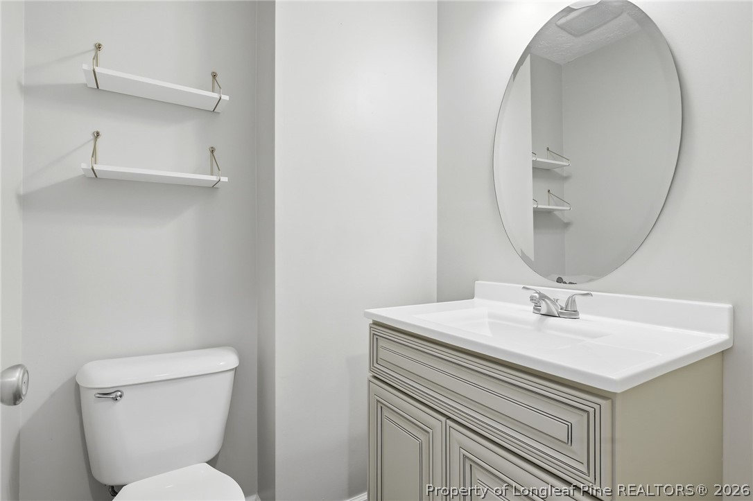 5113 Archer Road Hope Mills, NC 28348 - Photo 12 of 41 a bathroom with a sink and a mirror
