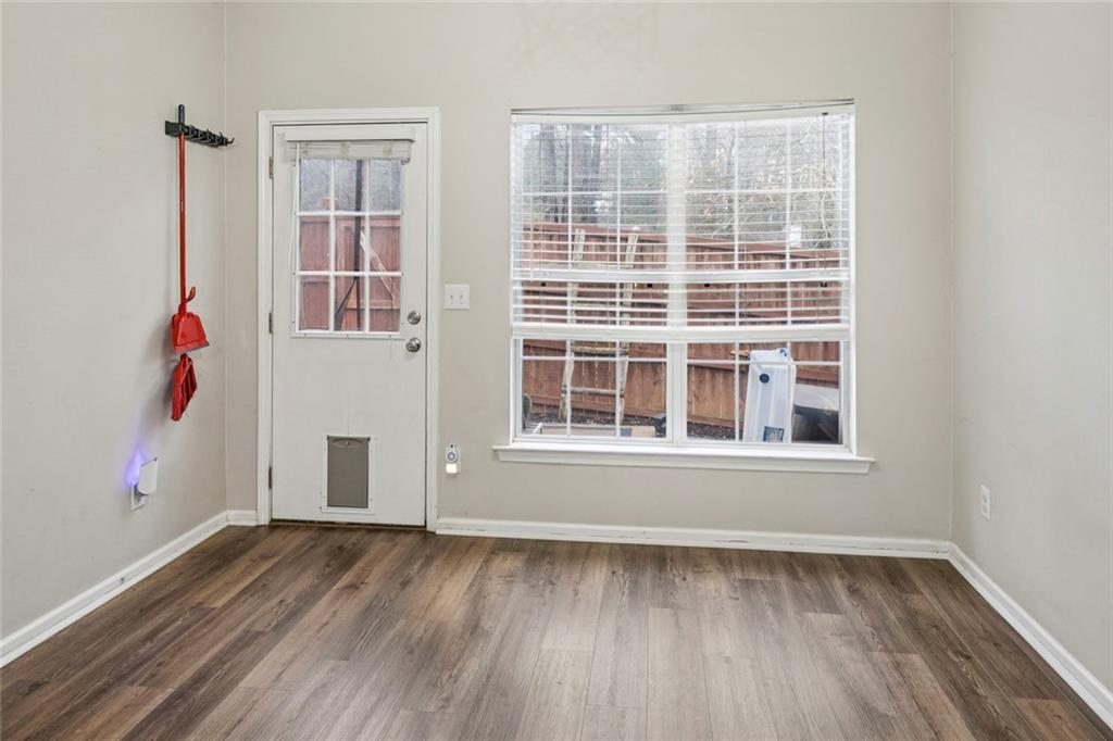 1257 Gates Circle Southeast Atlanta, GA 30316 - Photo 12 of 26 a view of an empty room with wooden floor and a window