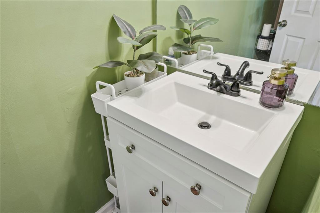 1257 Gates Circle Southeast Atlanta, GA 30316 - Photo 13 of 26 a bathroom with a sink and a mirror
