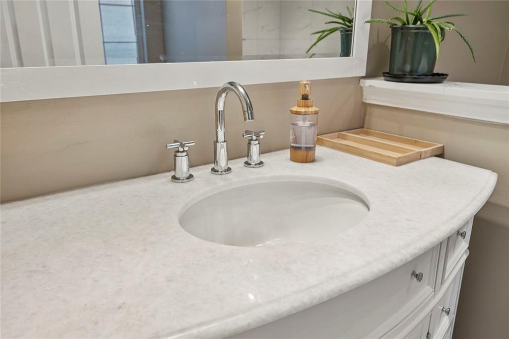 1257 Gates Circle Southeast Atlanta, GA 30316 - Photo 17 of 26 a bathroom with a sink and a mirror