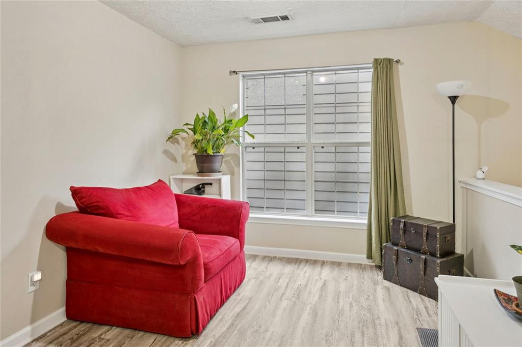 1257 Gates Circle Southeast Atlanta, GA 30316 - Photo 20 of 26 a living room with furniture and a potted plant