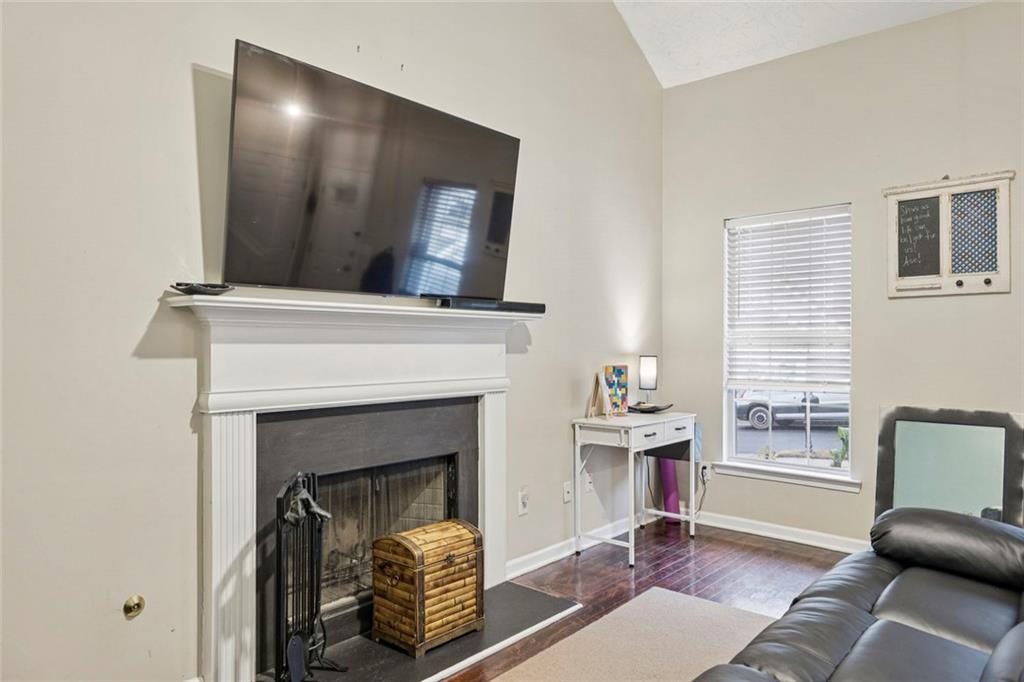 1257 Gates Circle Southeast Atlanta, GA 30316 - Photo 2 of 26 a living room with furniture and a fireplace
